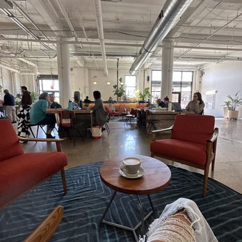 SK Coffee - people sitting at tables in a large open space - Coffee Roasteries Near Me - Saint Paul, Minnesota