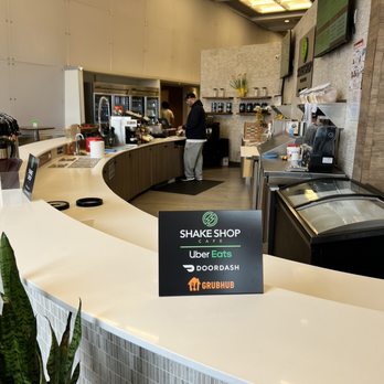 Shake shop cafe - a counter with a sign on it - Juice Bars & Smoothies Near Me - Armonk, New York Shake shop cafe - a counter with a sign on it - Juice Bars & Smoothies Near Me - Armonk, New York