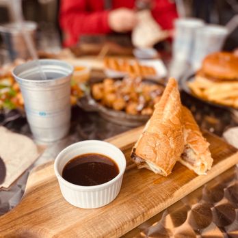 Steinerhaus BBQ - a table with sandwiches and dipping sauce - Barbeque Near Me - Temecula, California
