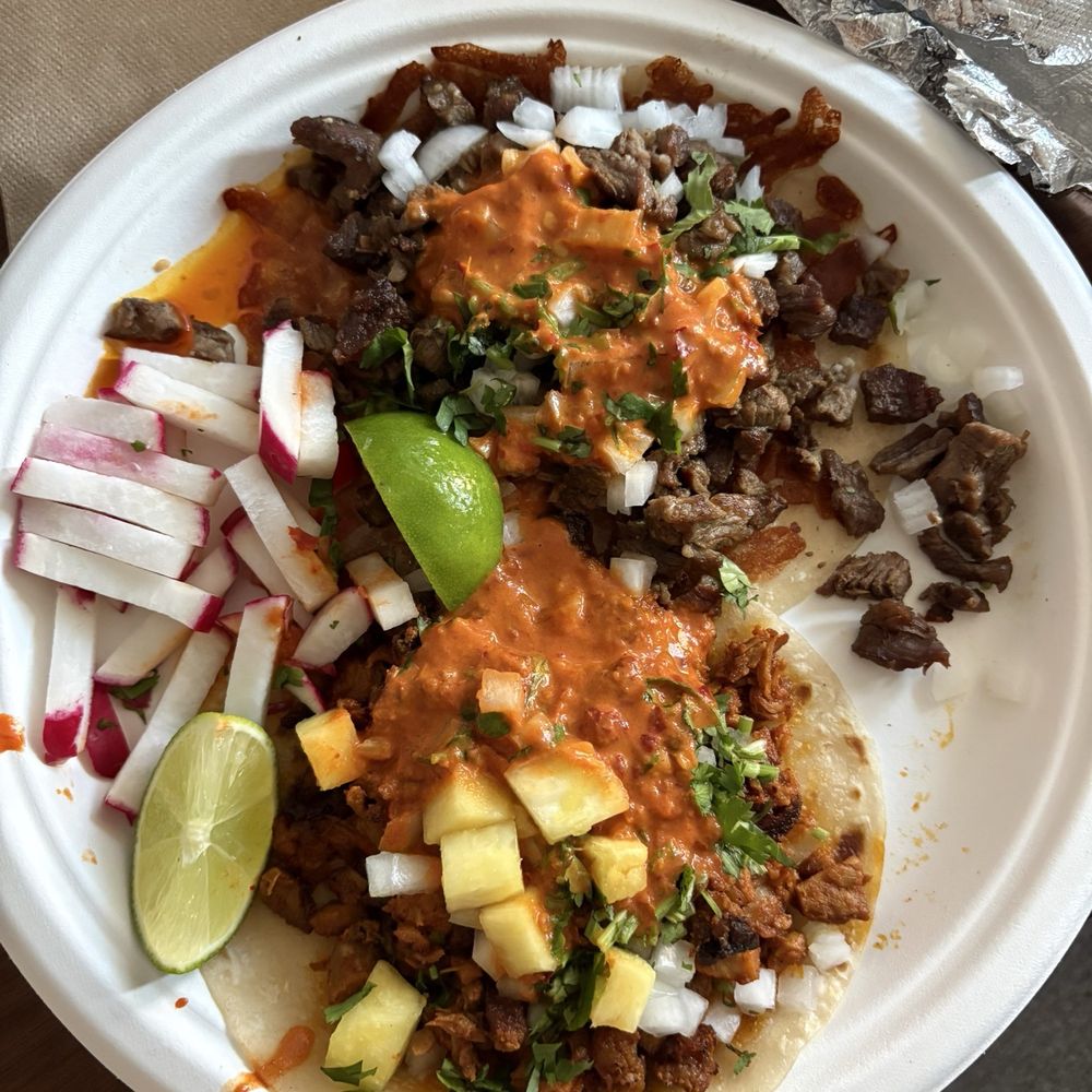 CaliSonora taco with carne asada and a Sonora with al pastor CaliSonora taco with carne asada and a Sonora with al pastor