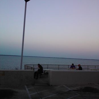 Dairy Queen Grill & Chill - In the relatively cool evening, people gather on the outdoor seating area propped up over the bluff and next to the bay. - Fast Food Near Me - Pensacola, Florida