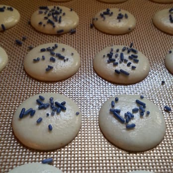 Belle’s Kitchen - Macarons on the way! Pretty white shells with pretty blue sprinkles for our Blueberry Lemon Curd Macarons! - Donuts Near Me - Oklahoma City, Oklahoma Belle’s Kitchen - Macarons on the way! Pretty white shells with pretty blue sprinkles for our Blueberry Lemon Curd Macarons! - Donuts Near Me - Oklahoma City, Oklahoma