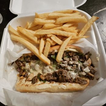 Lit Deli - Philly cheesesteak & fries. Onions, peppers, and mushrooms. Juicy! - Delis Near Me - Covington, Georgia