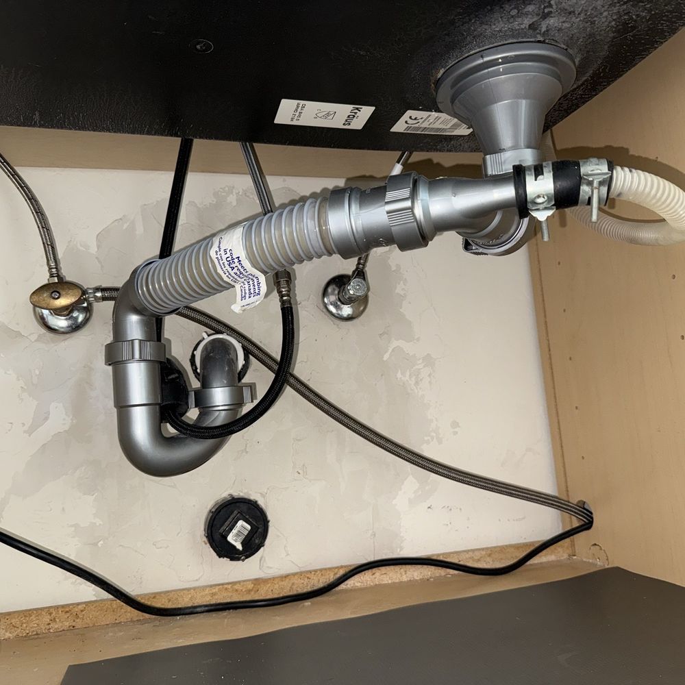 Clean Cut Builders - The "before" kitchen sink plumbing with slow draining 7/2025 (tip: try not to use corrugated piping) - Flooring Near Me - Tucson, Arizona Clean Cut Builders - The "before" kitchen sink plumbing with slow draining 7/2025 (tip: try not to use corrugated piping) - Flooring Near Me - Tucson, Arizona