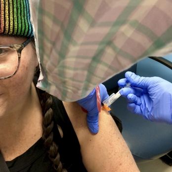 Walgreens - a woman getting a tattoo on her arm - Drugstores Near Me - Highwood, Illinois