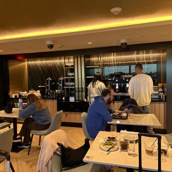 Etihad Lounge - seats/buffet in the back - Airport Lounges Near Me - Dulles, Virginia Etihad Lounge - seats/buffet in the back - Airport Lounges Near Me - Dulles, Virginia