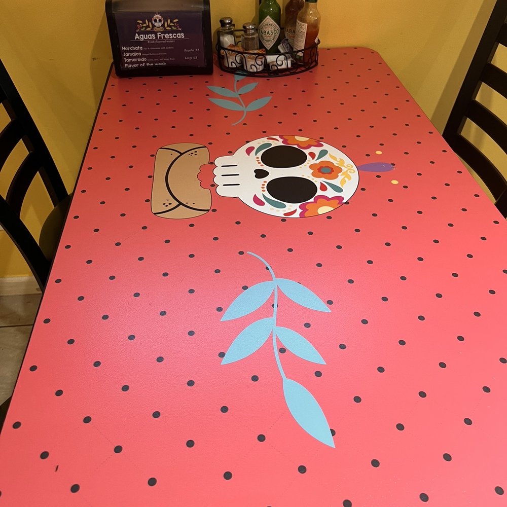 Pancho's Taquería & Mexican Cafe - a table with a sugar skull on it - Tacos Near Me - Circle Pines, Minnesota Pancho's Taquería & Mexican Cafe - a table with a sugar skull on it - Tacos Near Me - Circle Pines, Minnesota