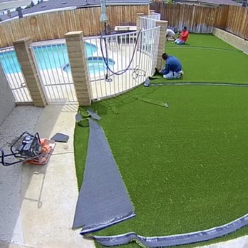Artificial Grass Solution - After they laid the weed blocker and now installing the turf. - Artificial Turf Near Me - Rancho Cucamonga, California