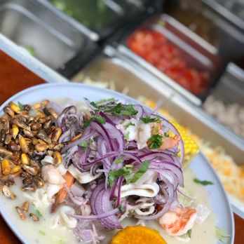 Mi Rico Peru - a plate of food on a table - Peruvian Near Me - Manassas, Virginia Mi Rico Peru - a plate of food on a table - Peruvian Near Me - Manassas, Virginia