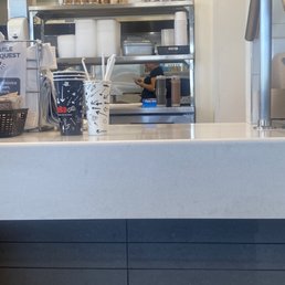On her phone next to the food. And just touched the food right after. On her phone next to the food. And just touched the food right after.