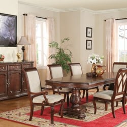 Woods Furniture Flexsteel Gallery - Ornately carved leaf designs at the top of the table legs meet intricately carved edging at the base of the tabletop, creating elegant feel.