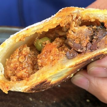 Lucuma Kitchen and Bar - Inside of a chicken empanadas - Peruvian Near Me - Oakland, California Lucuma Kitchen and Bar - Inside of a chicken empanadas - Peruvian Near Me - Oakland, California