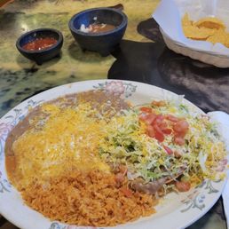 My combination meal of a cheese enchilada, bean tostada, rice and beans on the side. My combination meal of a cheese enchilada, bean tostada, rice and beans on the side.