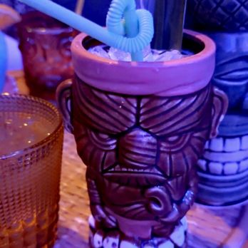 ShipWreck - a tiki cup with a toothbrush in it - Tiki Bars Near Me - Fort Worth, Texas