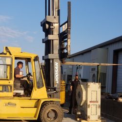 TLR Hydraulics - Stephen unloading a large 3000 pound gearbox for repair.