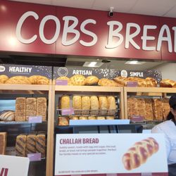 Cobs Bread - The breads behind the servers beautifully lined up, waiting to be inhaled.