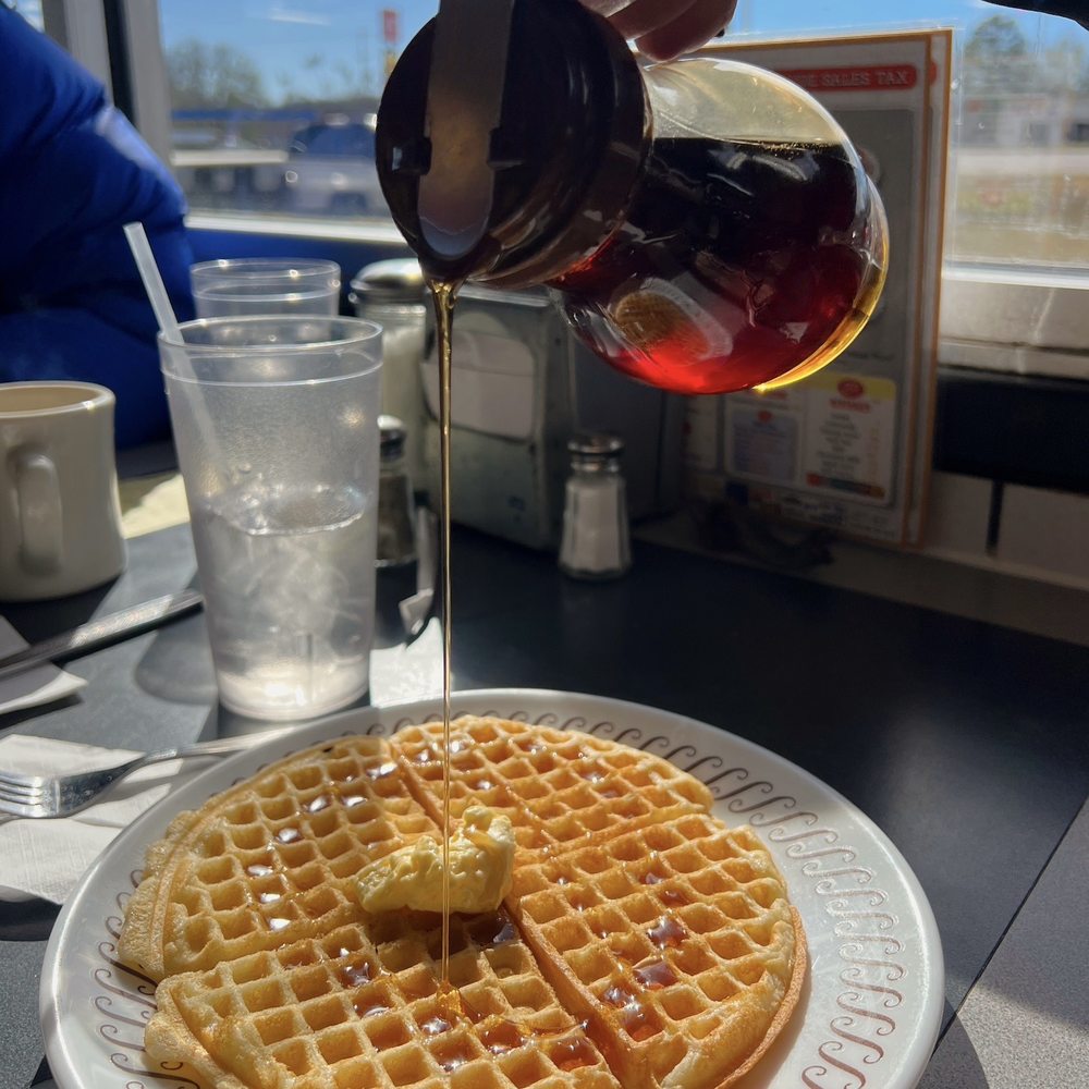 Waffle House - Florence - a person pouring syrup over a waffle - Diners Near Me - Florence, Mississippi Waffle House - Florence - a person pouring syrup over a waffle - Diners Near Me - Florence, Mississippi