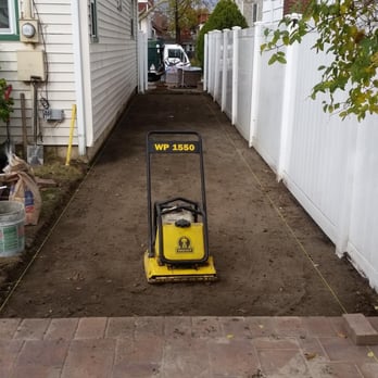 Madrid Landscaping - Here we are compacting the area. - Landscaping Near Me - Shoreham, New York Madrid Landscaping - Here we are compacting the area. - Landscaping Near Me - Shoreham, New York