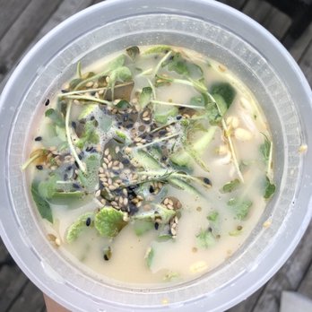 Bio Cafe - a person holding a bowl of soup - Cafes Near Me - Toronto, Ontario