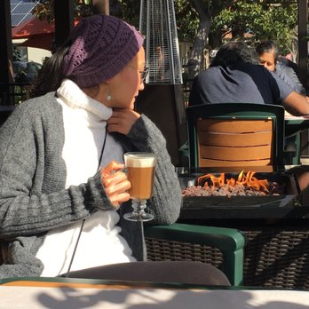 Vic's All Star Kitchen - Me enjoying my oatmilk latte in front of the fireplace - American Near Me - Pleasanton, California