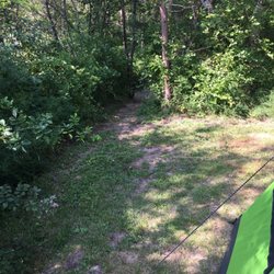 Dunromin Waterfront Campground & Cabins - Our site. Notice the bridge just in the woods.