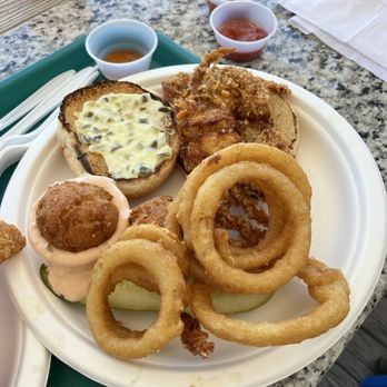 Promenade Grille - Soft shell crab sandwich with onion rings - Seafood Near Me - Havre De Grace, Maryland Promenade Grille - Soft shell crab sandwich with onion rings - Seafood Near Me - Havre De Grace, Maryland