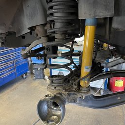 Mechanic is rebuilding the front birfield/knuckle joints. Mechanic is rebuilding the front birfield/knuckle joints.