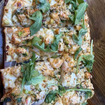 Napoleon House - Crawfish, shrimp with cheese and garlic on a flatbread roasted - American Near Me - New Orleans, Louisiana Napoleon House - Crawfish, shrimp with cheese and garlic on a flatbread roasted - American Near Me - New Orleans, Louisiana