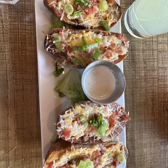 Cascade Roadhouse - Loaded potato skins appetizer - American Near Me - Grand Rapids, Michigan