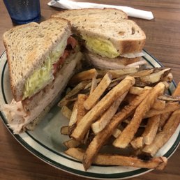 Buffalo Chicken Club Sandwich with a side of hand cut fries.