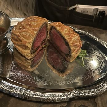 Wren & Wolf - 1/2 of the beef Wellington. This is what's left after the server served my wife and I each a generous portion. - Cocktail Bars Near Me - Phoenix, Arizona Wren & Wolf - 1/2 of the beef Wellington. This is what's left after the server served my wife and I each a generous portion. - Cocktail Bars Near Me - Phoenix, Arizona