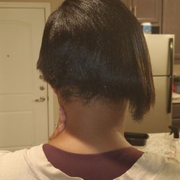 No Blending over the hair Blunt cut.  Literally a butcher could do a better job.