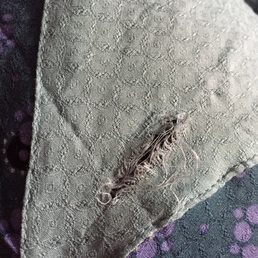 This hole is from a cashier taking the security tag off of a Free People dress I recently purchased. This hole is from a cashier taking the security tag off of a Free People dress I recently purchased.