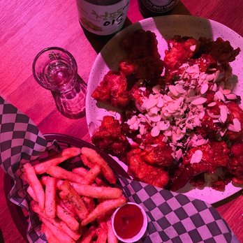 Pocha 1989 - a plate of chicken wings and french fries - Korean Near Me - Toronto, Ontario