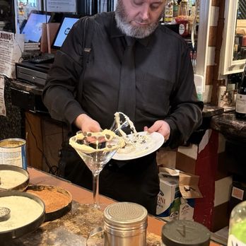 Filippo Ristorante & Bar - Making the rim on the cannoli martini - Italian Near Me - Boston, Massachusetts Filippo Ristorante & Bar - Making the rim on the cannoli martini - Italian Near Me - Boston, Massachusetts