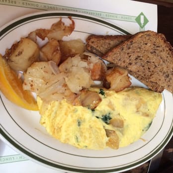 Raymond's - Spinach and caramelized onion omelette with home fries and 7- grain fruit. - American Near Me - Montclair, New Jersey