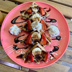 ARE Nutrition - Protein waffle topped with fresh fruits and you choice of drizzle.