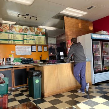 I Love Teriyaki - a man standing at the counter of a restaurant - Japanese Near Me - Seattle, Washington I Love Teriyaki - a man standing at the counter of a restaurant - Japanese Near Me - Seattle, Washington