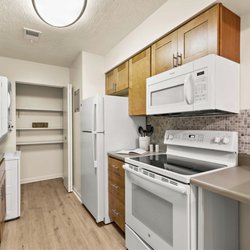 Pikeview Manor Apartments - This is our contemporary kitchen style, complete with soft-close cabinetry, glass tile backsplash, and luxury plank flooring.