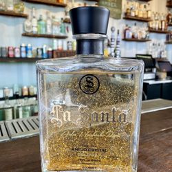 Stonefield Liquor & Discount Tobacco - Tequila La Santa Anejo cristalino with 24k gold flakes and led light