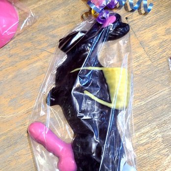 Breaking Bad - In all my days never seen a chocolate bunny like this one! - A unicorn-shaped cake covered in black and yellow icing, wrapped in clear plastic with colorful curling ribbons on top. - Art Tours Near Me