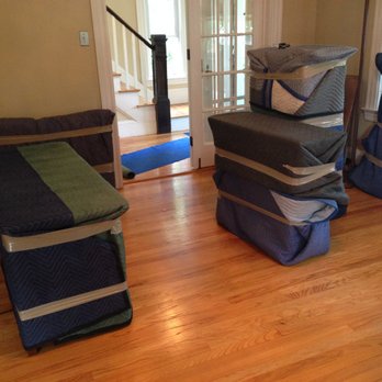 Mighty Michigan Movers - We pad wrap your furniture, keeping it safe from scuffs and scratches during transport. - Movers Near Me