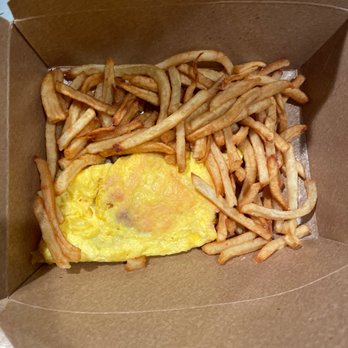 Bistro Zinc - This was omelet after I put it and the tasteless cold fries in take home box - French Near Me - Lenox, Massachusetts