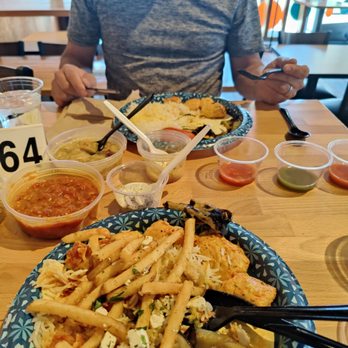 Chello Grill - We both had the chicken kabobs with green Chile chicken stew and roasted egg plant and all the fixings. - Mediterranean Near Me - Albuquerque, New Mexico