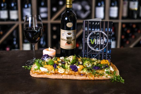 Photo of Village Vino - San Diego, CA, US. Try one of our tasty flatbreads