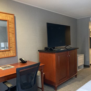The Polynesian Residences - Closer view of the desk and TV stand (refrigerator inside) - Hotels Near Me - Honolulu, Hawaii The Polynesian Residences - Closer view of the desk and TV stand (refrigerator inside) - Hotels Near Me - Honolulu, Hawaii