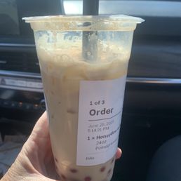 Honeydew Melon Milk Tea with popping Pomegranate Boba