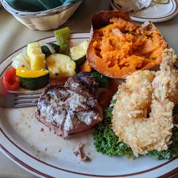 Rusty's Ranch House - Petit filet & coconut shrimp plate with baked sweet potato - Steakhouses Near Me - Cedar City, Utah Rusty's Ranch House - Petit filet & coconut shrimp plate with baked sweet potato - Steakhouses Near Me - Cedar City, Utah