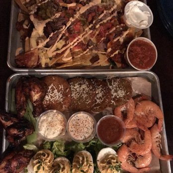 Dinosaur Bar-B-Que - Top platter is the BBQ Chili Nachos, where the second platter is the sampler (for 4). - Barbeque Near Me - Rochester, New York Dinosaur Bar-B-Que - Top platter is the BBQ Chili Nachos, where the second platter is the sampler (for 4). - Barbeque Near Me - Rochester, New York