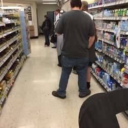 Walgreens - ALWAYS a huge wait here. This line hasn't moved in 15 Minutes
